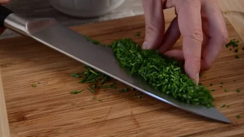 Cutting chive herbs Stock Footage 74395057