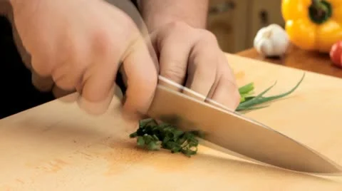 Cutting chives - slow motion Stock Footage 12712520