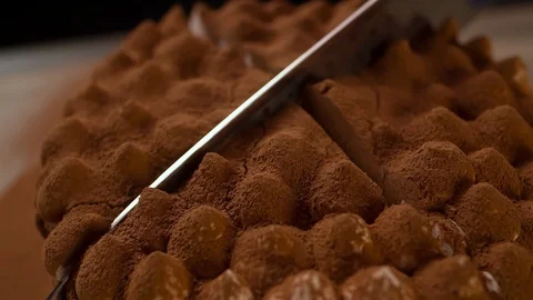 Cutting Chocolate Cake with Knife Closeup track-out camera Stock Footage 103256496