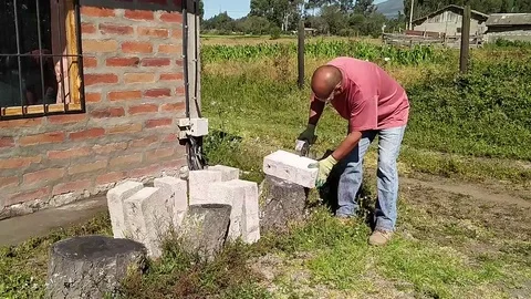 Cutting cinder blocks with an electric tool Stock Footage 127129264