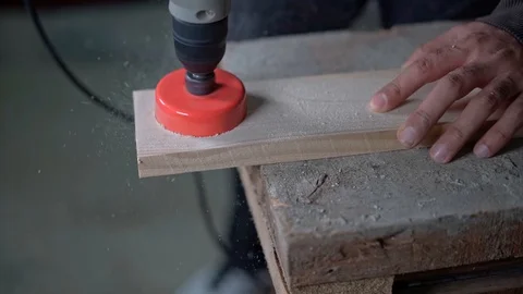 Cutting a circular hole on a wooden surface Stock Footage 129516219