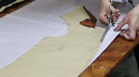 Cutting the cloth in atelier with scissors Stock Footage 55604381