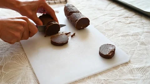 Cutting cocoa cookie dough on a board Stock Footage 219492045