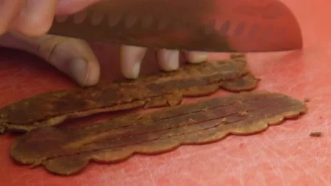 Cutting Cooked Bacon Strips Stock Footage 172259893