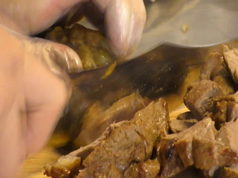 Cutting cooked meat. Stock Footage 70408869