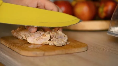 Cutting cooked meat with knife on board video 스톡 동영상 336684917