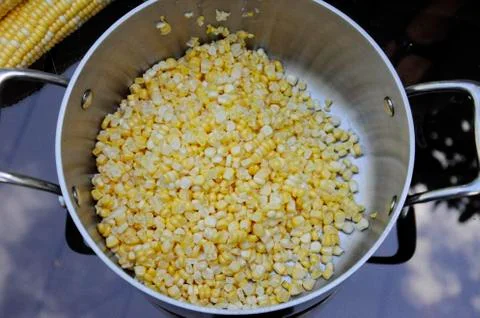 Cutting corn of the cob Stock Photos