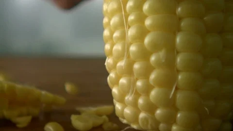 Cutting Corn Kernels Extreme Closeup Slowmotion2 스톡 동영상 84058931