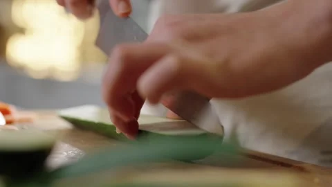 Cutting a Courgette on chopping board Stock Footage 254588738