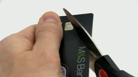 Cutting up a credit card through the computer chip Stock Footage