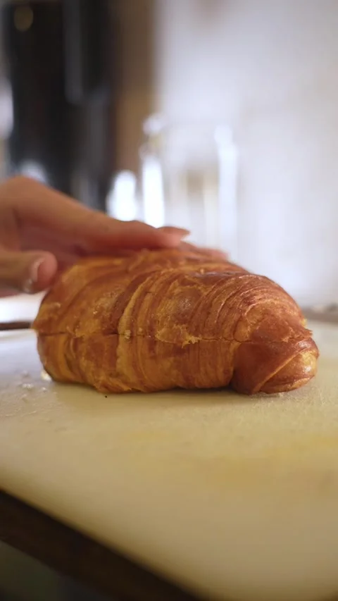 Cutting a croissant Stock Footage 321204569