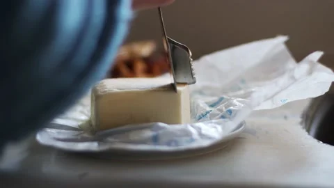 Cutting Cube Of Butter Close Up, 4K, Cinematic in Natural Lighting Stock Footage 237214821