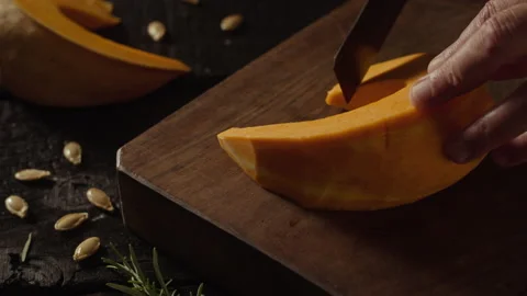 Cutting cubes froma a pumpkin slice Stock Footage 135078982