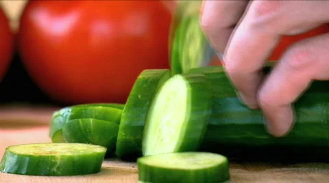 Cutting a Cucumber Stock Footage 734095