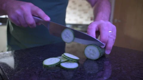 Cutting Cucumber on Granite Stock Footage 122127034