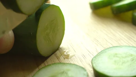 Cutting a cucumber with a knife, close-up, 4k Stock Footage 89191663