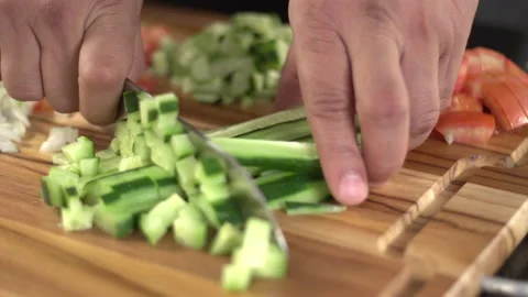 Cutting cucumber to make salad Stock Footage 160622342