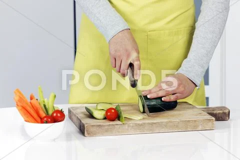 Cutting cucumber Stock Photos