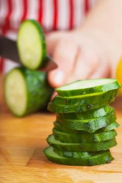 Cutting cucumber Stock Photos