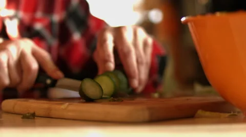 Cutting up Cucumber  for a Salad Stock Footage 58631058