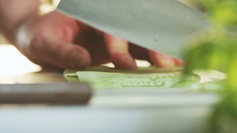 Cutting Cucumber Seen From the Side Stock Footage 71073697