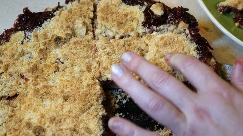 Cutting delicious Cherry Pie on plate. Serving on table in the Kitchen. Isolated Stock Footage 124033103