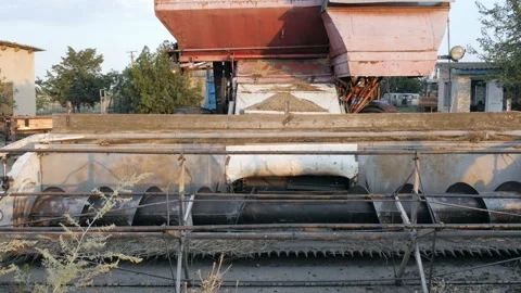 The cutting device of the combine harvester. Camera moving by slider equipment Stock Footage 104698047
