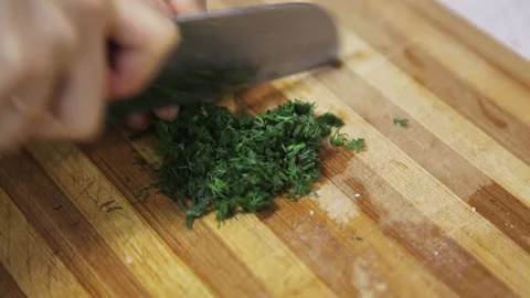 Cutting dill with professional knife Stock Footage 143892746