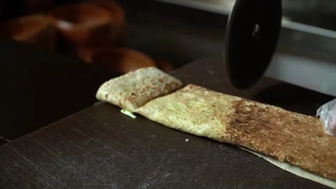 Cutting Dosa in a Kitchen Stock Footage 319950306