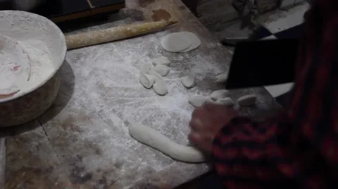 Cutting dough and making dumpling wrappers Stock Footage 46615432
