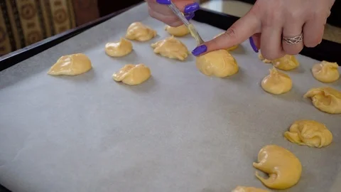 Cutting the dough into the cake Stock Footage 105461596
