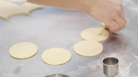 Cutting the dough into circles Stock Footage 307339963