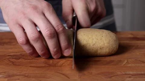 Cutting Dough In Half With Knife Front View Close Up Stockbeeldmateriaal 334336990