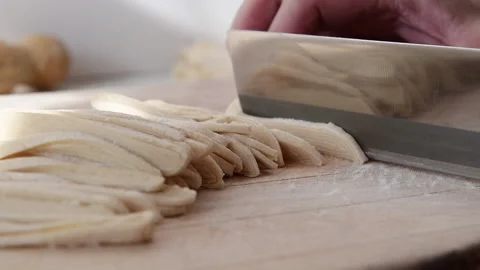 Cutting the dough into noodles. Stock Footage 149154322