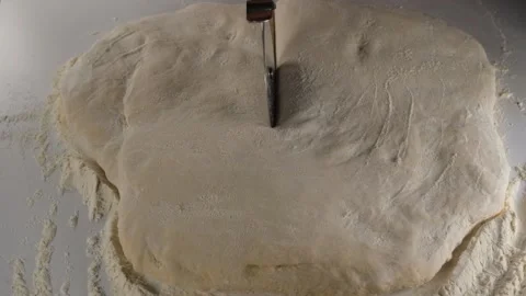 Cutting dough in slow motion Stock Footage 238015400