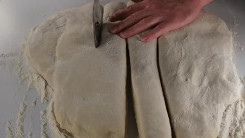 Cutting dough slow motion Stock Footage 241030842