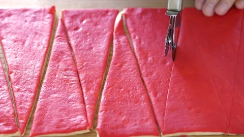 Cutting the dough into triangles special cutter. Stock Footage 89386049