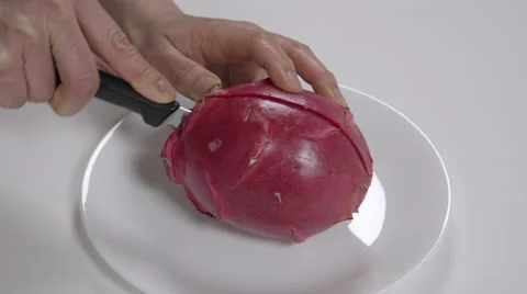 Cutting a dragon fruit. 4K UHD Stock Footage 48335418