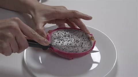 Cutting a dragon fruit. 4K UHD Stock Footage 48336549