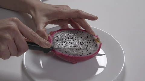 Cutting a dragon fruit. 4K UHD Stock-Footage 48337523