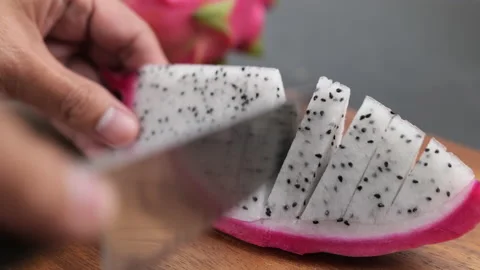 Cutting dragon fruit on cutting board Video stock 148274739