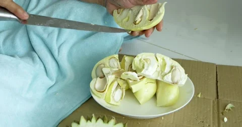 Cutting durian fruit a culinary event at home food preparation close-up view Stock Footage 337450036