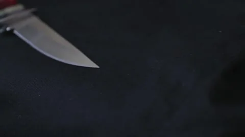 THE CUTTING EDGE - Close Up Dolly Along Knife Blade Stock Footage 44108714