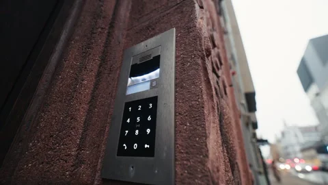 A cutting edge Modern Intercom System installed prominently on an Urban Wall Stock Footage 299475256