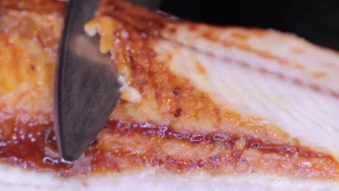 Cutting an eel with a knife  Stock Footage 82697879