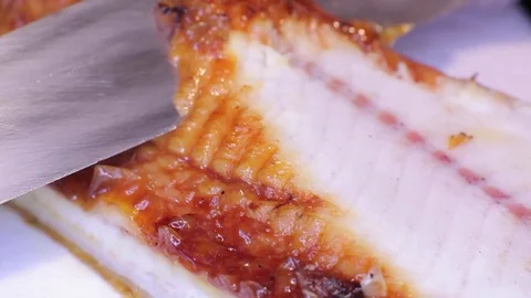 Cutting an eel with a knife (two) Stock Footage 82698234