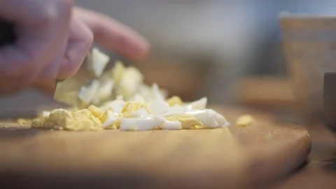 Cutting egg with a knife Stock Footage 127695256