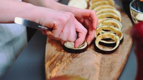 Cutting the eggplant core before frying Stock Footage 252388360