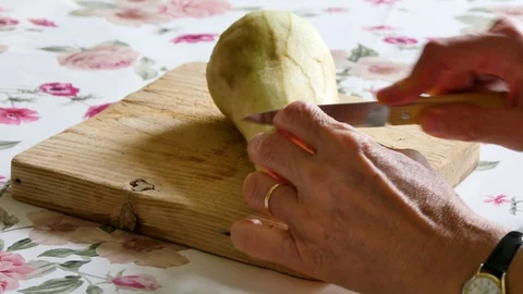Cutting an eggplant in a kitchen. Video stock 94960053