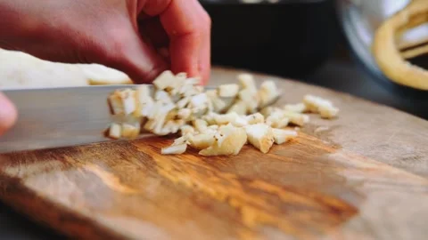 Cutting the eggplant into small pieces Stock Footage 252358535